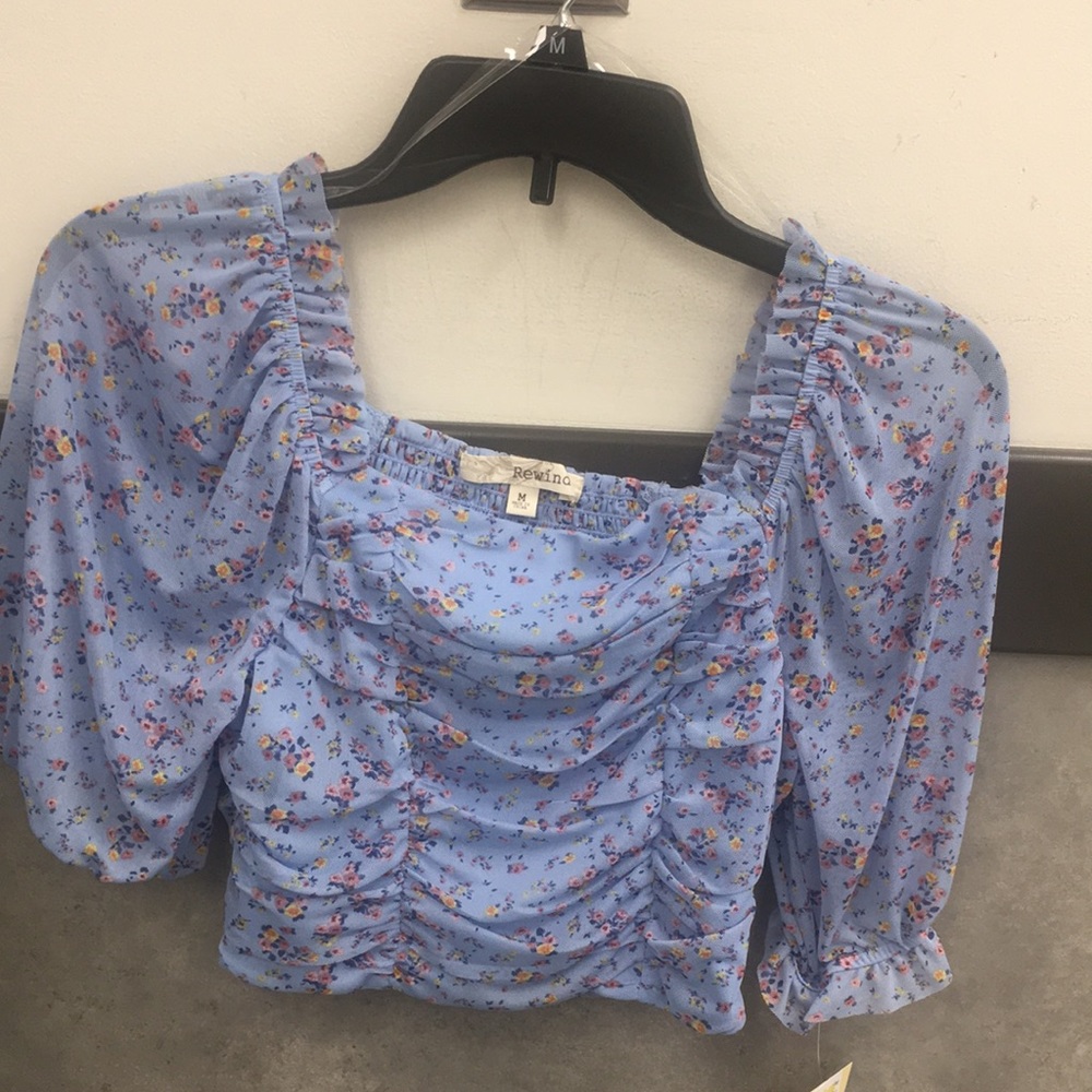Woman’s or Juniors Crop top. Pretty blue with colorful small flowers.
